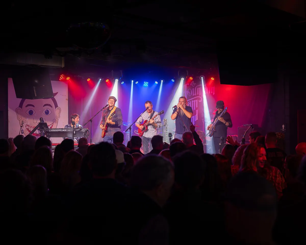 The Mountain Jam Band performing for a crowd
